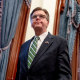 Texas Lt. Gov. Dan Patrick exits a press conference at the state Capitol in Austin on March 31, 2020.
