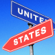 Photo illustration: Two signs, one blue with the text,\"United\" and one red with the text,\"States\", pointing in different directions.