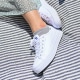 White sneakers on a blanket