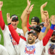 Image: Bryce Harper #3 of the Philadelphia Phillies celebrates with teammates.