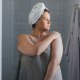 Beautiful Plus Size Woman Applying Body Lotion after Taking a Shower