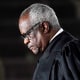 Supreme Court Justice Clarence Thomas listens as President Donald Trump speaks before he administers the Constitutional Oath to Amy Coney Barrett at the White House on Oct. 26, 2020.