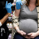 A pregnant woman receives a Covid-19 vaccination at Skippack Pharmacy in Schwenksville, Pa., on Feb. 11, 2021.
