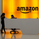 People stand in the lobby for Amazon offices in New York on Feb. 14, 2019.