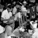 Japanese Americans deal with paperwork at an internment camp in the early 1940s.