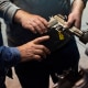 NRA members are seen examining handguns and other