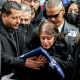 Image: Family members of NYPD Officer Wilbert Mora react after receiving a flag from the honor guard following Mora's funeral at St. Patrick's Cathedral, on Feb. 2, 2022, in New York.