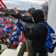 Trump supporters clash with police and security forces as they invade the Inauguration platform of the U.S. Capitol in Washington, DC on Jan. 6, 2021.