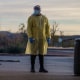 Image: A healthcare worker waits for the next patient at a drive-thru