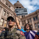 State troopers watch as protesters take part in the Women's March and Rally for Abortion Justice at the State Capitol in Austin, Texas, on Oct. 2, 2021.