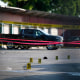 The scene of a shooting is pictured behind police yellow tape after two people were killed and three more critically injured in a shooting at a flea market in Houston, Texas on May 15, 2022.