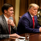 Secretary of Defense Mark Esper, left, President Donald Trump, and Chairman of the Joint Chiefs of Staff Army Gen. Mark A. Milley, right, wait for a meeting with senior military leaders in the Cabinet Room of the White House on Oct. 7, 2019.