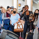 Travelers, some wearing masks,  at Hartsfield-Jackson Atlanta International Airport on April 19, 2022, one day after a federal judge struck down the mask mandate on airplanes, trains and other public transportation.