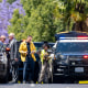 Investigators gather outside the Geneva Presbyterian Church in Laguna Woods, Calif., on Sunday, May 15, 2022 after a fatal shooting.