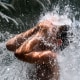 A young boy cools down in a waterfall at Yards Park in Washington on Aug. 12, 2021, as an extreme heat wave hits the region.