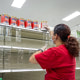 A worker restocks shelves with baby formula at a store in Pinole, Calif., on May 17, 2022