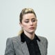 Amber Heard stands in the courtroom at the Fairfax County Circuit Court in Fairfax, Va., on May 24, 2022.