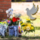 Image: The photo of a little girl, victim of the shooting, is seen by flowers placed on a makeshift memorial in front of Robb Elementary School in Uvalde, Texas, on May 25, 2022.