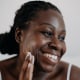 Skin care using cosmetic skin cream Woman with black skin