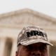 A person wears an NRA hat in front of the US Supreme Court in Washington, D.C. on Tuesday.