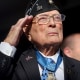 Hershel "Woody" Williams, a World War II veteran and recipient of the Medal of Honor, salutes the flag during the national anthem at the groundbreaking ceremony for the National Medal of Honor Museum, on March 25, 2022, in Arlington, Texas.