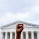 Image: An abortion rights activist stands outside the Supreme Court  on June 24, 2022 in Washington, D.C.