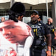 A protester stares down an Akron police officer outside the Harold K. Stubbs Justice Center during a protest on July 2, 2022, in Akron, Ohio, after Akron police officers shot and killed Jayland Walker earlier.