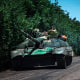 Image: A tank with a Ukrainian soldier heads towards Lysychansk, Ukraine, on June 10, 2022.