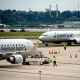 Airplanes sit on the tarmac at Ronald Reagan Washington National Airport in Arlington, Va., on July 2, 2022.