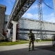 A Russian serviceman guards in an area of the Zaporizhzhia Nuclear Power Station, the largest nuclear power plant in Europe, in territory under Russian military control, southeastern Ukraine, on May 1, 2022.