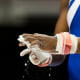 Image: A female gymnast prepare for a competition