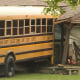 A school bus crashed into a home in College Corner, Ohio, on Aug. 15, 2022.