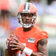 Cleveland Browns quarterback Deshaun Watson looks to throw during NFL football practice in Berea, Ohio, on Aug. 16, 2022.