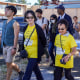 People march to commemorate the centennial of the Chinese community's pushback against segregation in Victoria, Canada, on Sept. 5, 2022.