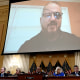 Stewart Rhodes, founder of the Oath Keepers, is seen on a screen during a House Select Committee hearing to Investigate the January 6th Attack on the US Capitol on Capitol Hill in Washington, DC on June 9.