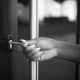 Close-up shot of a hand of an unrecognizable African American woman unlocking the door