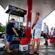 People wait in line at the Top Fuel gas station to fill their tanks on Sept. 20, 2022, in Cabo Rojo, Puerto Rico.