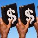 Photo Illustration: Hand holding a bible emblazoned with a dollar sign