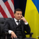 Image: Ukrainian President Volodymyr Zelensky looks on at President Donald Trump.