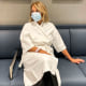 Katie Couric sits on a chair in a medical center, in a photo posted to her instagram