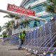 Image: Workers install a flood barrier to secure Tampa General Hospital in anticipation of Hurricane Ian, in Tampa, Fla., on Sept. 27, 2022.