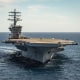 The aircraft carrier USS Nimitz (CVN 68) steams forward in the Pacific Ocean on March 12, 2022.