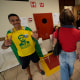 A supporter of Brazilian President Jair Bolsonaro, who is running for another term, makes the victory sign next to a voter wrapped in a flag of the Worker Party of former President Luiz Inacio Lula da Silva, who is running for president again, during general elections in Brasilia, Brazil, Sunday.