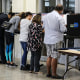 Voters fill out their ballots in Miami on Nov. 06, 2018.
