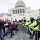 Insurrectionists loyal to President Donald Trump try to break through a police barrier, Wednesday, Jan. 6, 2021, at the Capitol in Washington. Facing prison time and dire personal consequences for storming the U.S. Capitol, some Jan. 6 defendants are trying to profit from their participation in the deadly riot, using it as a platform to drum up cash, promote business endeavors and boost social media profiles.