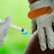 A health worker administers a dose of a Pfizer COVID-19 vaccine in Reading, Pa.