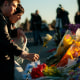 Image: People leave flowers at the growing memorial near the shooting scene inside Club Q in Colorado Springs, Colorado.
