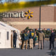Members of the FBI and other law enforcement investigate the site of a fatal shooting in a Walmart  in Chesapeake, Va.