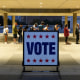 Voters wait in line at a polling place at the Lyndon B. Johnson School of Public Affairs in Austin, Texas
