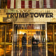 Image: Security guards stand at the entrance to Trump Tower in New York.